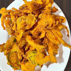 Best Onion Pakora gram flour onion with touch of mango powder Chatt masala served with pakora chutney. in Deer Park, NY