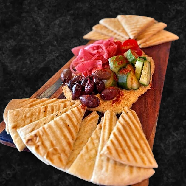 Best Loaded hummus platter with Kalamata olives, house made pickled onion, cucumber and tomato in Johnson City, TN